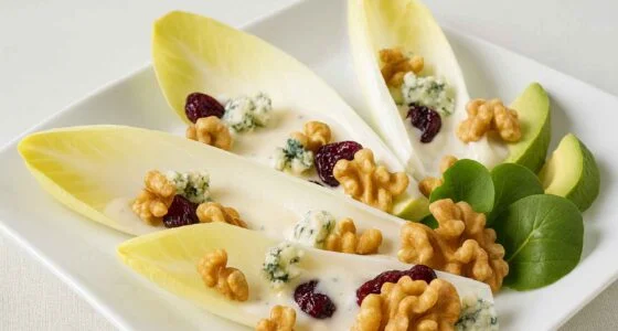 Endive salad with roquefort cheese and toasted cashews, plated by a private chef